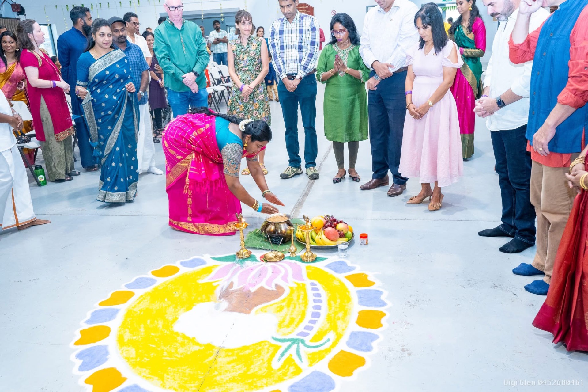 Lighting the kolam at a community ceremony