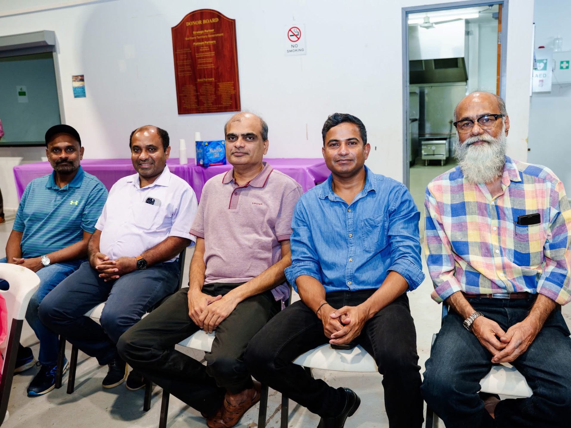 Community members seated together at a function