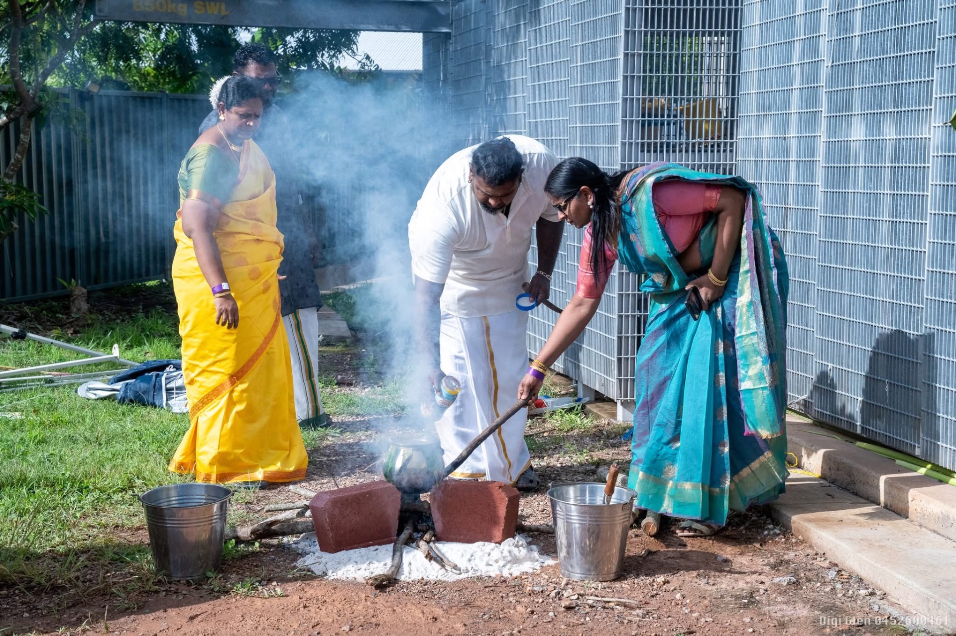 Cooking the traditional Pongal pot outdoors