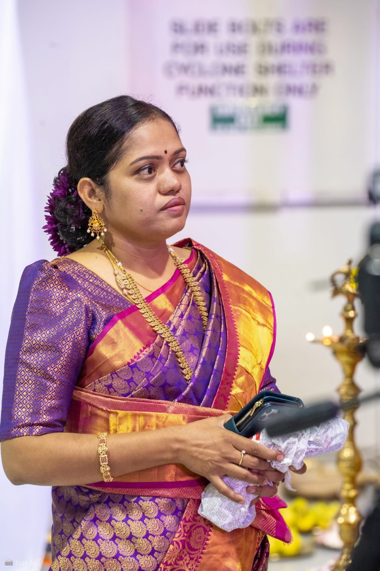 Portrait of a community member in a traditional silk saree