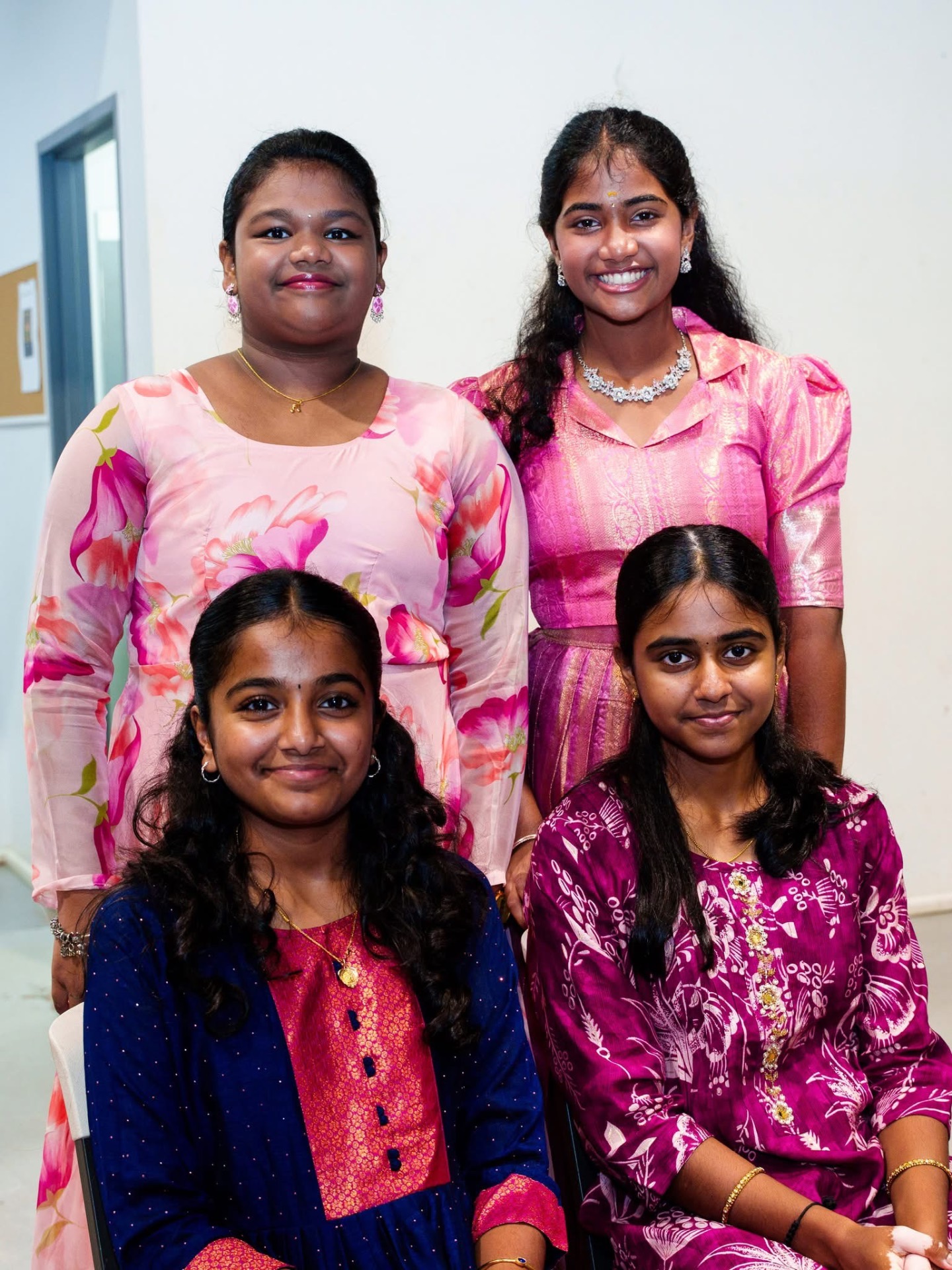Four youth members posing for a portrait
